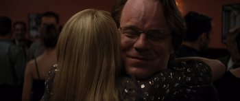 Movie still from “Synecdoche, New York” (2008), directed by Charlie Kaufman – A man and a woman embracing each other; Close Up shot, Over the shoulder angle