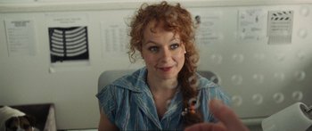 Movie still from “Synecdoche, New York” (2008), directed by Charlie Kaufman – A person with curly red hair; Close Up shot, Over the shoulder angle