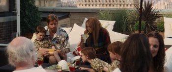Movie still from “Synecdoche, New York” (2008), directed by Charlie Kaufman – A group of people sitting on top of a couch; Medium shot, High angle