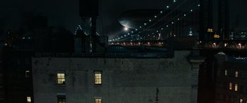 Movie still from “Synecdoche, New York” (2008), directed by Charlie Kaufman – A view of a bridge and a building at night; Extreme Wide shot, Low angle