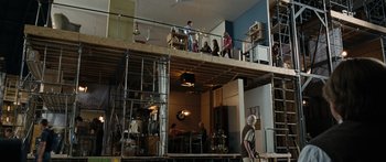 Movie still from “Synecdoche, New York” (2008), directed by Charlie Kaufman – A group of people standing on top of a wooden structure; Extreme Wide shot, Low angle