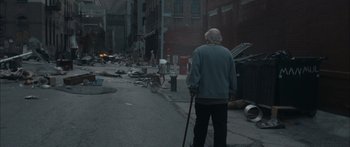 Movie still from “Synecdoche, New York” (2008), directed by Charlie Kaufman – An old man walking down the street with a cane; Wide shot, High angle