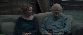 Movie still from “Synecdoche, New York” (2008), directed by Charlie Kaufman – A man and a woman sitting on a couch; Medium shot, Over the shoulder angle