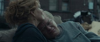 Movie still from “Synecdoche, New York” (2008), directed by Charlie Kaufman – An older man and a younger woman snuggling; Close Up shot, Over the shoulder angle