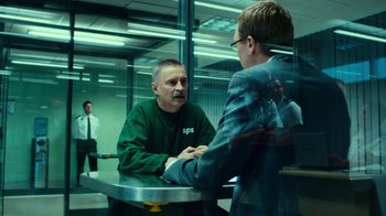 Movie still from “T2 Trainspotting” (2017), directed by Danny Boyle – Two men sitting at a table in front of each other; Medium shot, Over the shoulder angle