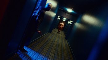 Movie still from “T2 Trainspotting” (2017), directed by Danny Boyle – Two men are walking down a hallway in a building; Wide shot, High angle