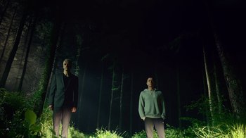 Movie still from “T2 Trainspotting” (2017), directed by Danny Boyle – Two men standing next to each other in the woods; Wide shot, Low angle