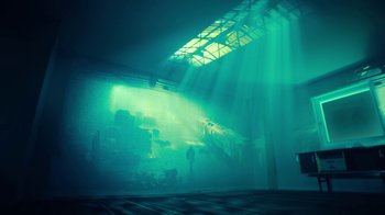 Movie still from “T2 Trainspotting” (2017), directed by Danny Boyle – A person standing in front of an aquarium with sunlight coming through the windows; Extreme Wide shot, Low angle