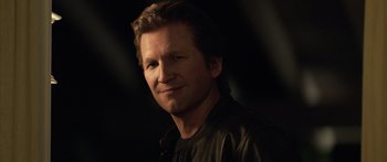 Movie still from “TRON: Legacy” (2010), directed by Joseph Kosinski – A person wearing a leather jacket; Close Up shot, Over the shoulder angle