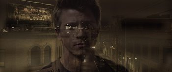 Movie still from “TRON: Legacy” (2010), directed by Joseph Kosinski – A man is looking out of a window at night; Close Up shot, High angle