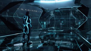 Movie still from “TRON: Legacy” (2010), directed by Joseph Kosinski – A man standing in a room that has a lot of lights in it; Extreme Wide shot, High angle