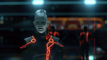 Movie still from “TRON: Legacy” (2010), directed by Joseph Kosinski – An image of a man in a tron costume; Medium shot, Low angle