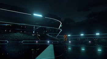 Movie still from “TRON: Legacy” (2010), directed by Joseph Kosinski – A person standing in a stadium at night; Extreme Wide shot, Low angle