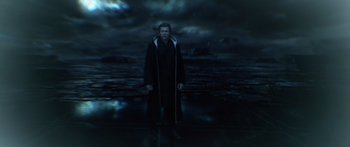 Movie still from “TRON: Legacy” (2010), directed by Joseph Kosinski – A man standing in front of a body of water; Medium shot, Over the shoulder angle