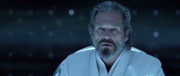 Movie still from “TRON: Legacy” (2010), directed by Joseph Kosinski – An older man with a beard is wearing a white robe; Close Up shot, Over the shoulder angle