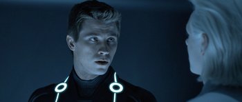 Movie still from “TRON: Legacy” (2010), directed by Joseph Kosinski – A young man with a glowing ring around his neck; Close Up shot, Low angle