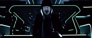 Movie still from “TRON: Legacy” (2010), directed by Joseph Kosinski – A man in a black jacket with a glowing hood; Close Up shot, Low angle