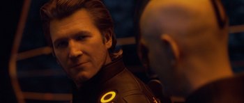Movie still from “TRON: Legacy” (2010), directed by Joseph Kosinski – A person wearing a leather jacket; Close Up shot, Over the shoulder angle