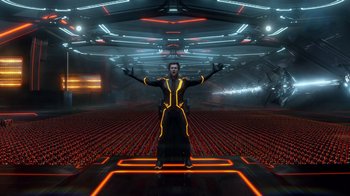 Movie still from “TRON: Legacy” (2010), directed by Joseph Kosinski – A man standing in a room with neon lights; Wide shot, Low angle