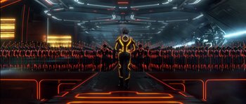 Movie still from “TRON: Legacy” (2010), directed by Joseph Kosinski – An image of a man that is in a room with neon lights; Extreme Wide shot, High angle