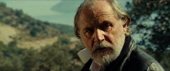 Movie still from “Taken 2” (2012), directed by Olivier Megaton – An old man with a beard and a mustache; Close Up shot, Low angle