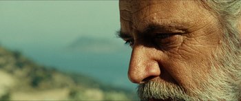 Movie still from “Taken 2” (2012), directed by Olivier Megaton – An old man with a beard and a mustache; Extreme Close Up shot, Low angle