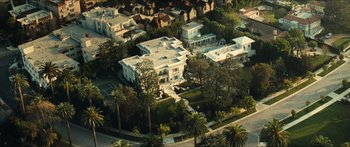 Movie still from “Taken 2” (2012), directed by Olivier Megaton – An aerial view of a large white house with palm trees; Extreme Wide shot, Overhead angle