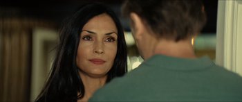Movie still from “Taken 2” (2012), directed by Olivier Megaton – A woman looking at a man in the mirror; Close Up shot, Over the shoulder angle