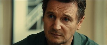 Movie still from “Taken 2” (2012), directed by Olivier Megaton – A man's face as he stares ahead; Close Up shot, Over the shoulder angle