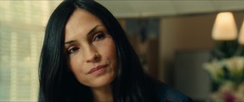 Movie still from “Taken 2” (2012), directed by Olivier Megaton – A person with long black hair; Close Up shot, Over the shoulder angle