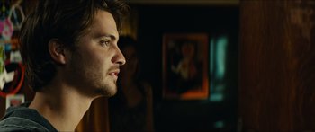 Movie still from “Taken 2” (2012), directed by Olivier Megaton – A person looking at a painting; Close Up shot, Over the shoulder angle