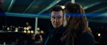 Movie still from “Taken 2” (2012), directed by Olivier Megaton – A man and a woman standing next to each other on a boat; Close Up shot, Over the shoulder angle