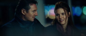 Movie still from “Taken 2” (2012), directed by Olivier Megaton – A man and a woman standing next to each other; Close Up shot, Over the shoulder angle