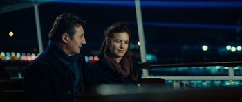 Movie still from “Taken 2” (2012), directed by Olivier Megaton – A man and a woman sitting at a table; Medium shot, Over the shoulder angle