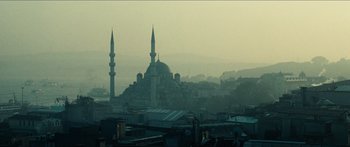 Movie still from “Taken 2” (2012), directed by Olivier Megaton – A view of a city with a mosque in the background; Extreme Wide shot, Low angle