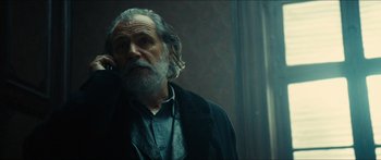 Movie still from “Taken 2” (2012), directed by Olivier Megaton – An old man with a beard and a long white beard; Close Up shot, Low angle