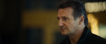Movie still from “Taken 2” (2012), directed by Olivier Megaton – A person looking to his left; Close Up shot, Over the shoulder angle