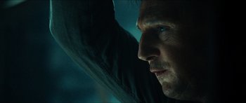 Movie still from “Taken 2” (2012), directed by Olivier Megaton – A man's face as he leans against a wall; Close Up shot, Low angle