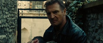 Movie still from “Taken 2” (2012), directed by Olivier Megaton – Liam neeson holding a monkey; Close Up shot, Over the shoulder angle