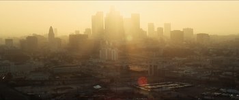 Movie still from “Taken 2” (2012), directed by Olivier Megaton – The sun is setting over a large city; Extreme Wide shot, High angle