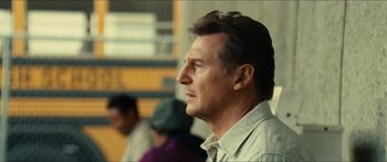 Movie still from “Taken 2” (2012), directed by Olivier Megaton – A person wearing a shirt; Close Up shot, Low angle