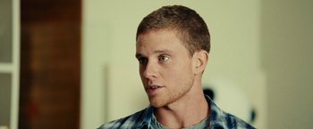 Movie still from “Taken 3” (2014), directed by Olivier Megaton – A person wearing a shirt; Close Up shot, Over the shoulder angle