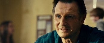 Movie still from “Taken 3” (2014), directed by Olivier Megaton – A person wearing a blue shirt; Close Up shot, Over the shoulder angle