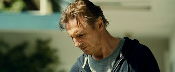 Movie still from “Taken 3” (2014), directed by Olivier Megaton – A person wearing a hoodie; Close Up shot, Low angle