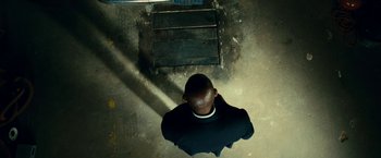 Movie still from “Taken 3” (2014), directed by Olivier Megaton – A man standing in the middle of a room; Wide shot, Overhead angle