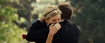 Movie still from “Taken 3” (2014), directed by Olivier Megaton – A man and a woman hugging each other; Close Up shot, Over the shoulder angle