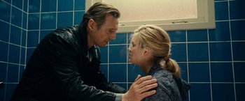 Movie still from “Taken 3” (2014), directed by Olivier Megaton – A man and a woman are looking at one another in a bathroom; Close Up shot, Over the shoulder angle