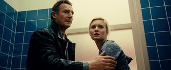 Movie still from “Taken 3” (2014), directed by Olivier Megaton – A man and a woman standing next to each other; Close Up shot, Low angle