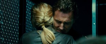 Movie still from “Taken 3” (2014), directed by Olivier Megaton – A man and a woman hugging each other; Close Up shot, Over the shoulder angle