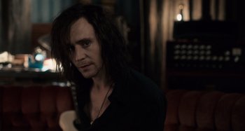 Movie still from “Only Lovers Left Alive” (2013), directed by Jim Jarmusch – A person with long black hair; Medium shot, Over the shoulder angle